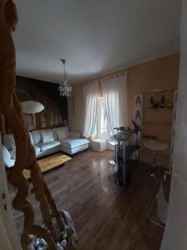 a living room with a couch and a table at La Loggia Di Federico in Navelli