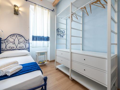 a bedroom with a bunk bed and a ladder at "Bea's Terrace" - Private Jacuzzi and panoramic rooftop in the City Centre in Cagliari