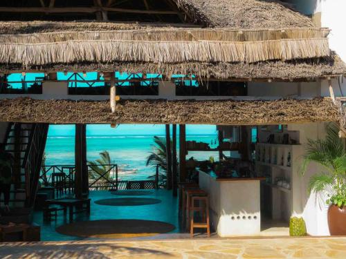 a resort with a view of the ocean at Hekaya Zanzibar in Pingwe