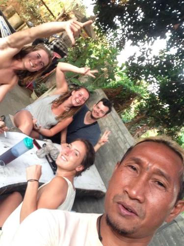 a group of people posing for a picture at Apollo Hostel in Lovina