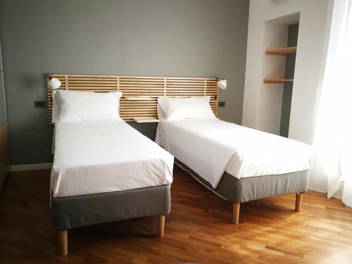 Voodi või voodid majutusasutuse Carulli 69 - Check-in Express apartments toas