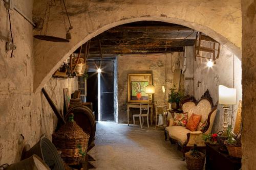 a living room with an archway in a building at Palazzo Malaspina B&B in Tavarnelle in Val di Pesa