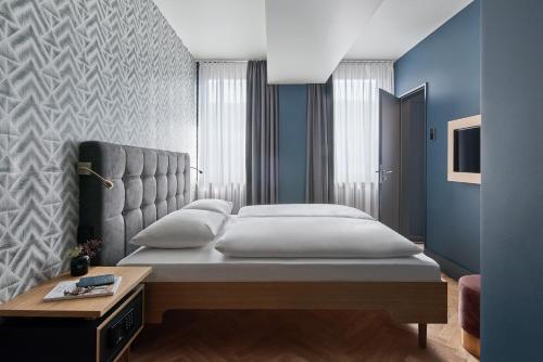 Postel nebo postele na pokoji v ubytování Hotel MIO by AMANO