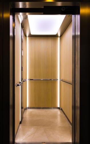 a hallway with an open door to a room at Marina Burgas Hotel in Burgas City