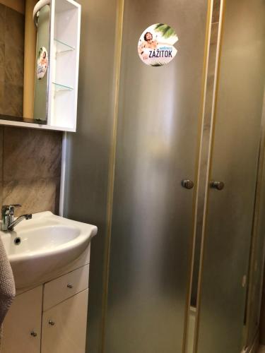 a bathroom with a shower and a sink at Ubytovanie Poprad in Poprad