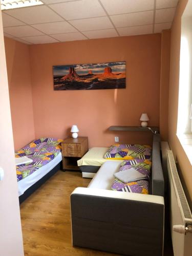 two beds in a small room with two beds at Ubytovanie Poprad in Poprad