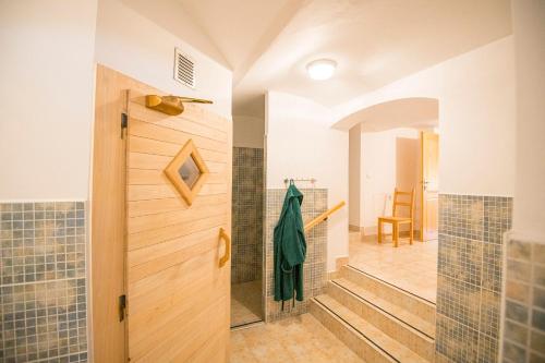 a bathroom with a walk in shower and a walk in shower at Penzion Kryštof in Kovářská