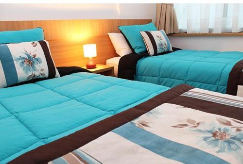 En eller flere senge i et værelse på Hotel Romano