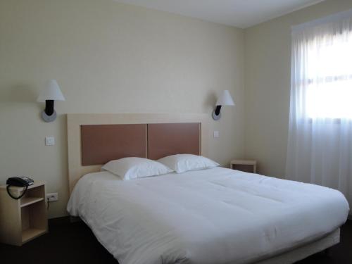 Кровать или кровати в номере Hotel Talencia