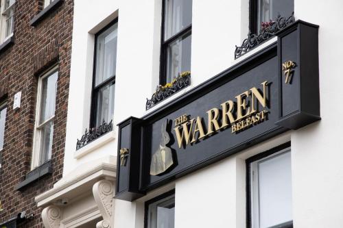 a sign for a warren restaurant on the side of a building at The Warren Belfast in Belfast