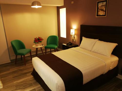 Ένα ή περισσότερα κρεβάτια σε δωμάτιο στο Hotel Inclan