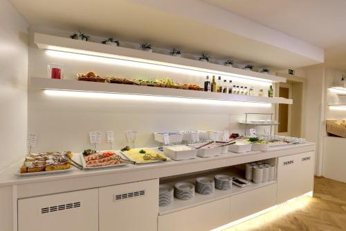 a buffet with many food items on display at ASTORIA Hotel & Medical Spa in Karlovy Vary