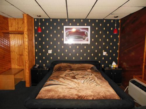 Un ou plusieurs lits dans un hébergement de l'établissement Motor Court Motel