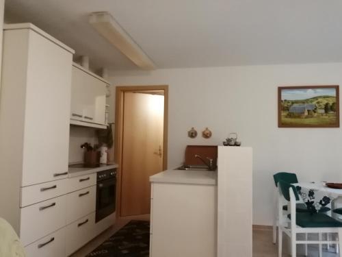Kuchyň nebo kuchyňský kout v ubytování Haus Königstein FeWo Bielablick