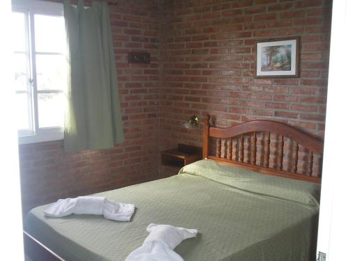 En eller flere senge i et værelse på El Mirador de Nono