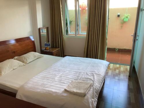 Ένα ή περισσότερα κρεβάτια σε δωμάτιο στο Thảo Chi