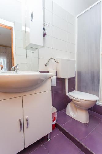 a bathroom with a sink and a toilet at Villa Valentina in Zadar