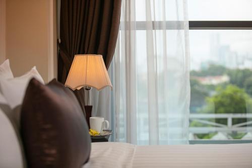 Katil atau katil-katil dalam bilik di Adonis Hotel