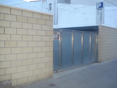 a building with a parking sign on the side of it at Hotel Isabel in Briviesca
