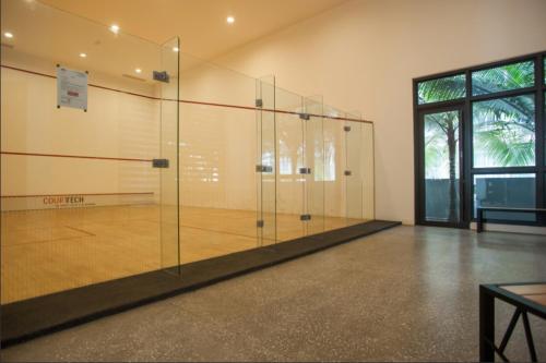 a large glass tennis court with a racket at KLCC The Mews Home in Kuala Lumpur
