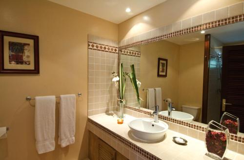 a bathroom with a sink and a mirror at Studio Orient Bay in Orient Bay