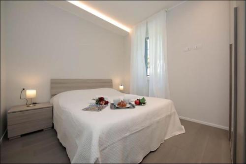 Postel nebo postele na pokoji v ubytování Villa Regina int.3