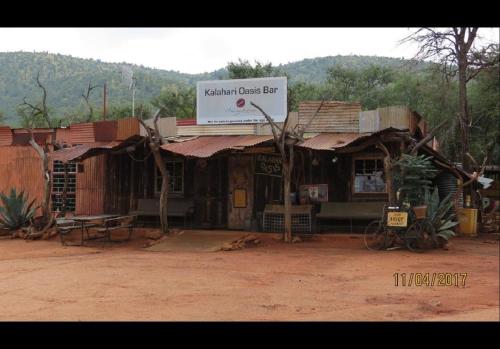 a small building with a sign on top of it at Bush Dream, Mabalingwe in Mabula