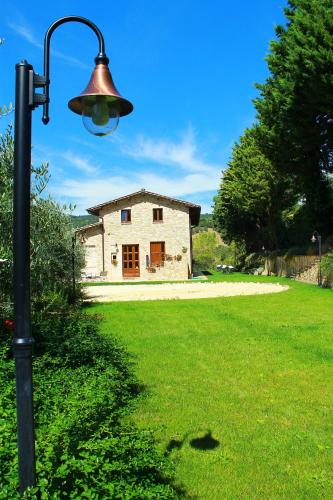 a street light in front of a house at Antica Fonte in Assisi