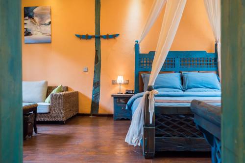 Ein Bett oder Betten in einem Zimmer der Unterkunft The Ritz-Man Boutique Inn Lijiang