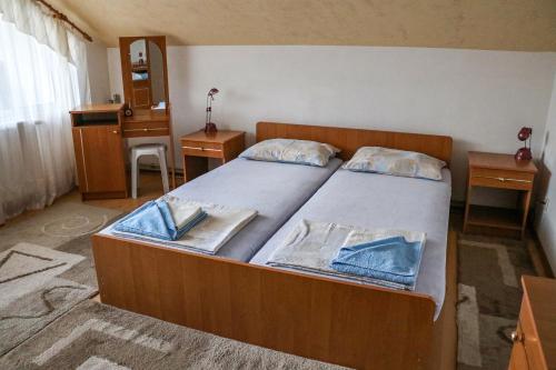 A bed or beds in a room at Nature Guesthouse