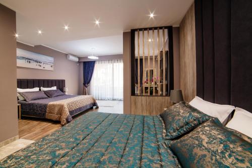 a hotel room with two beds and a bed sqor at Hotel Princess & Spa in Ulcinj