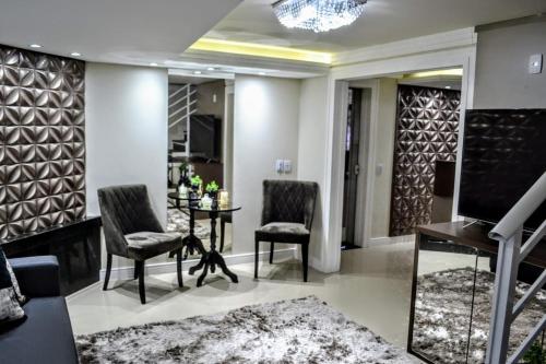 Posezení v ubytování Ideal Lages Hotel