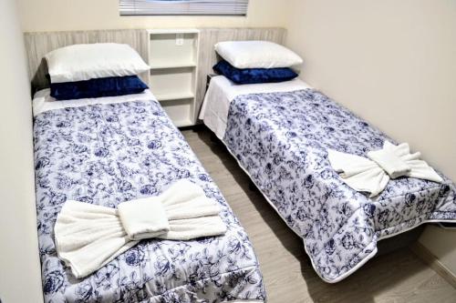 Ένα ή περισσότερα κρεβάτια σε δωμάτιο στο Ideal Lages Hotel