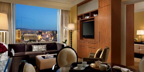 a living room with a couch and a large window at Trump International Hotel Las Vegas in Las Vegas