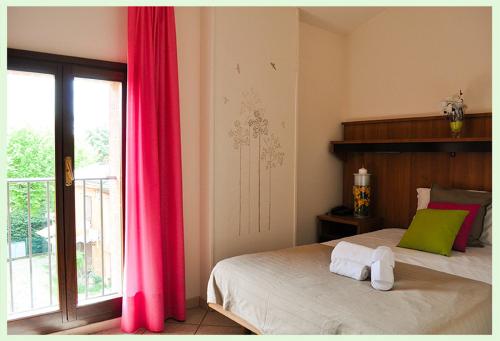 מיטה או מיטות בחדר ב-Hotel EMI