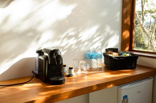 a wooden counter top with a radio on it at Winter Suites Campos do Jordão - Capivari in Campos do Jordão