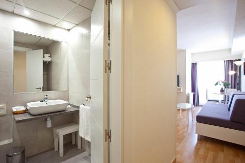a bathroom with a sink and a mirror at Ona Princesa Playa in Marbella
