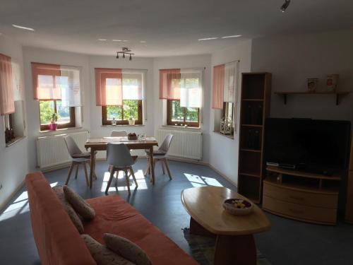 a living room with a couch and a table at Zollern-Alb Aktiv in Albstadt