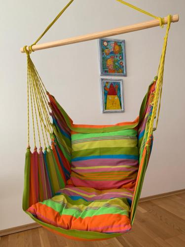 a colorful hammock hanging in a room at Apartmán Štefánka in Púchov