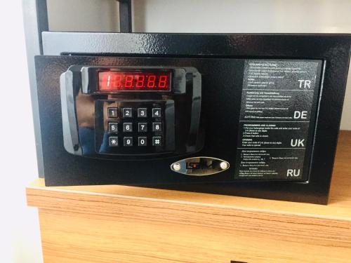 a microwave oven sitting on top of a cabinet at Set Özer Hotel in Canakkale