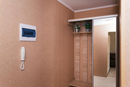 a bathroom with a phone on a wall at Luxury apart-hotel on Kharkovskaya neer Manufaktura in Sumy