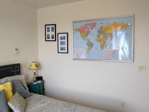 a map of the world hanging on a wall at 13 Hills Bed & Breakfast in South Acworth