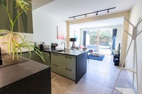 a kitchen with a sink and a counter at Unique Central Town House in Norwich