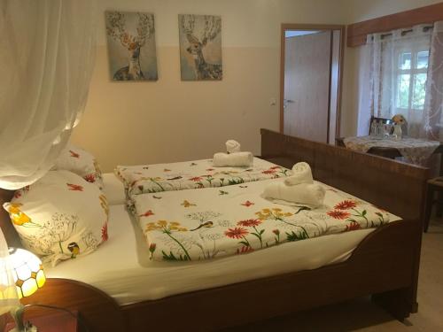 a bedroom with two beds with towels on them at Alte Schule Niederdünzebach in Eschwege