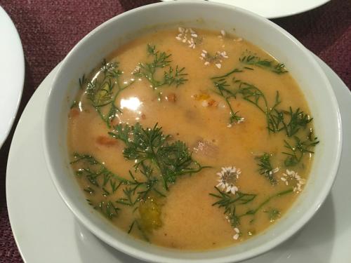 a bowl of soup on a white plate at Alte Schule Niederdünzebach in Eschwege