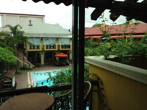 a view from a balcony of a hotel with a swimming pool at Crown Regency Residences Davao in Davao City
