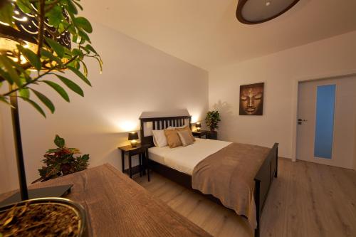 A bed or beds in a room at Le Monde Apartment Bratislava - amazing 5BDR in downtown