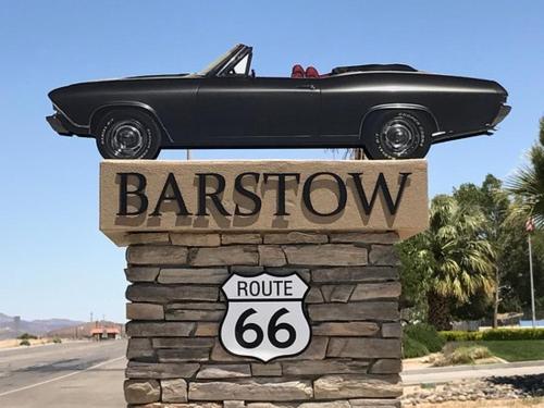 a car sitting on top of a barreon sign at Travelodge by Wyndham Barstow in Barstow