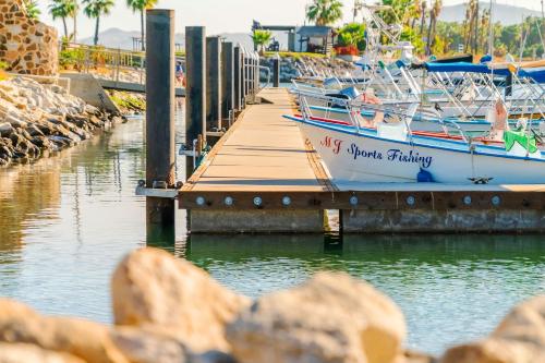 a boat is docked at a dock in the water at Hyatt Place Los Cabos in San José del Cabo