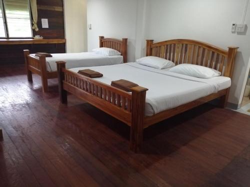 Postel nebo postele na pokoji v ubytování Jansom Beach Resort